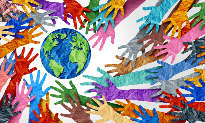 Image of different coloured paper cut outs of hands surrounding the earth