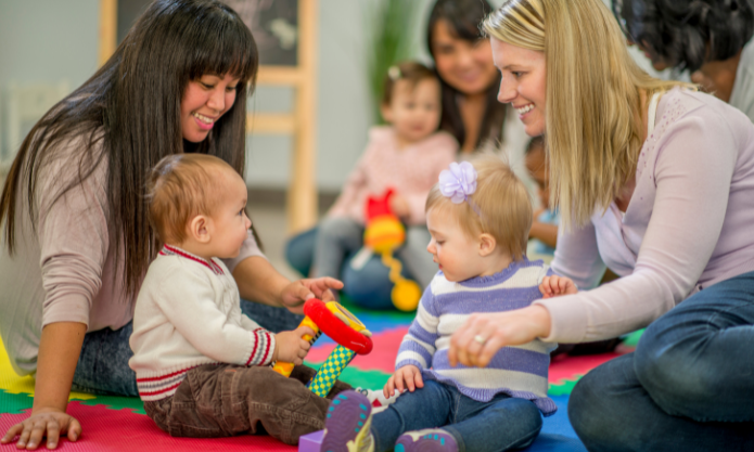 Parents playing with young children during playgroup